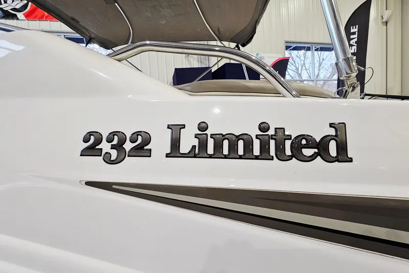 Slide: The Image of 2009 Yamaha Boats 232 Limited, close-up of model name on white hull. - 25