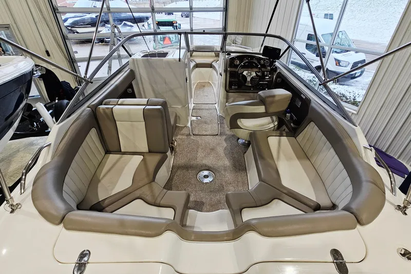 Slide: The Image of 2009 Yamaha Boats 232 Limited interior with plush seating and modern dashboard. - 7