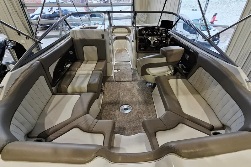 Slide: The Image of 2009 Yamaha Boats 232 Limited interior with spacious seating and modern dashboard. - 8
