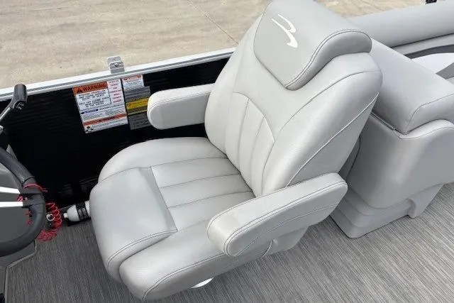 Slide: The Image of 2022 Bennington S 22 Quad Bench boat seat, featuring plush gray upholstery and ergonomic design. - 22