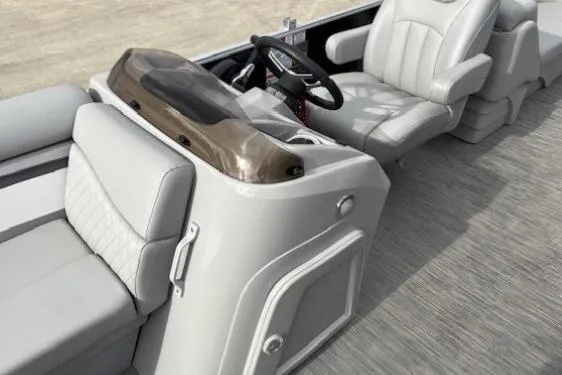 Slide: The Image of 2022 Bennington S 22 Quad Bench interior with steering wheel and seating. - 23