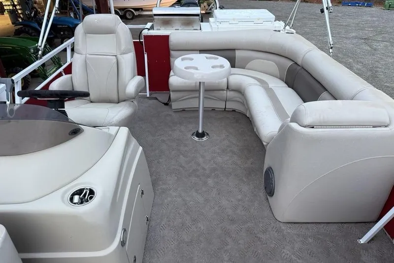 Slide: The Image of Interior of a 2014 JC NepToon 24 Limited pontoon boat with beige seating. - 16