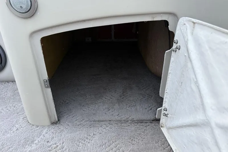 Slide: The Image of Open storage compartment on a 2014 JC NepToon 24 Limited boat. - 17