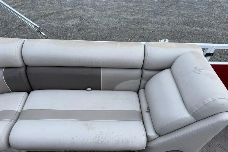 Slide: The Image of 2014 JC NepToon 24 Limited boat seat with beige and gray upholstery. - 18