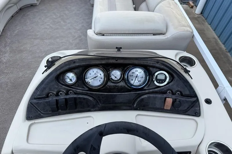 Slide: The Image of Dashboard of a 2014 JC NepToon 24 Limited pontoon boat with gauges and controls. - 20