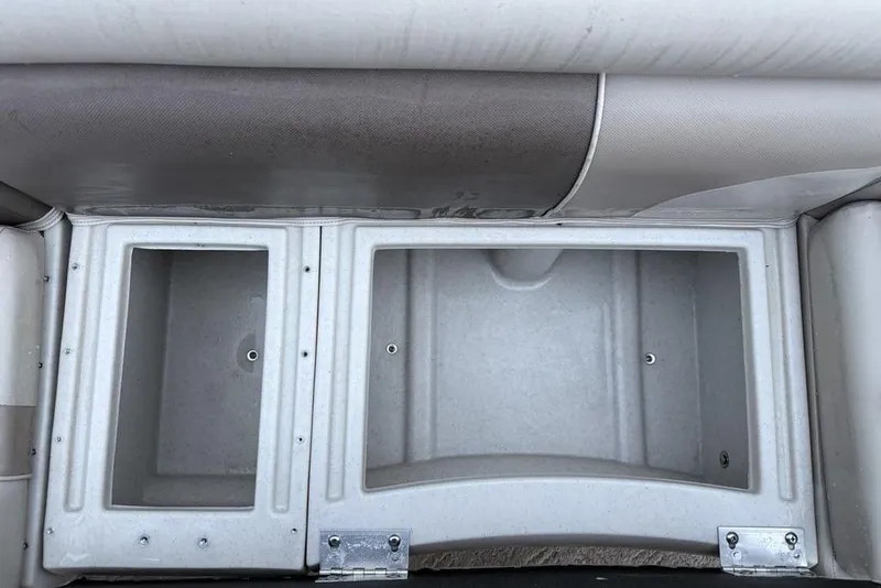 Slide: The Image of Storage compartments on a 2014 JC NepToon 24 Limited pontoon boat. - 21