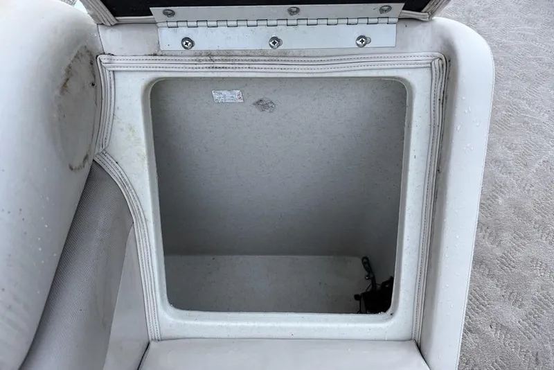 Slide: The Image of Open storage compartment in 2014 JC NepToon 24 Limited boat seat. - 24