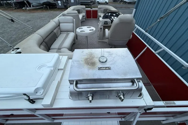 Slide: The Image of 2014 JC NepToon 24 Limited pontoon boat with grill and seating area. - 30