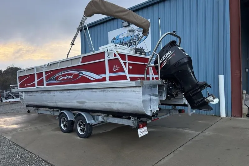Slide: The Image of 2014 JC NepToon 24 Limited pontoon boat with Suzuki outboard motor on trailer. - 4