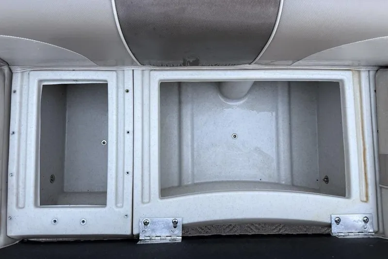 Slide: The Image of 2014 JC NepToon 24 Limited boat storage compartments, open and empty. - 8