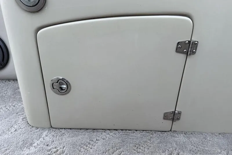 Slide: The Image of Interior of a 2014 JC NepToon 24 Limited pontoon boat with beige seating. - 15