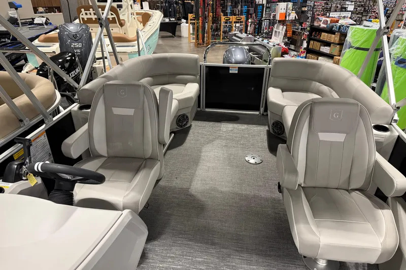 Slide: The Image of 2025 Godfrey Xperience 2086 SBX pontoon boat interior with plush seating and modern design. - 5