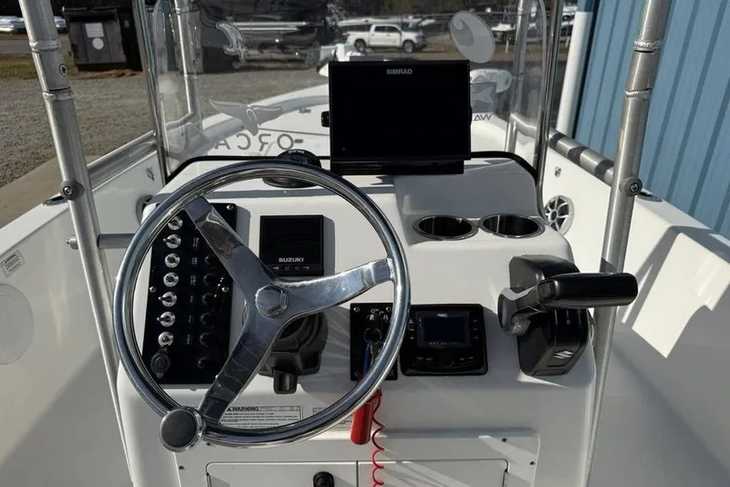 Slide: The Image of 2020 Sea Pro 172 Bay boat console with steering wheel and navigation equipment. - 11