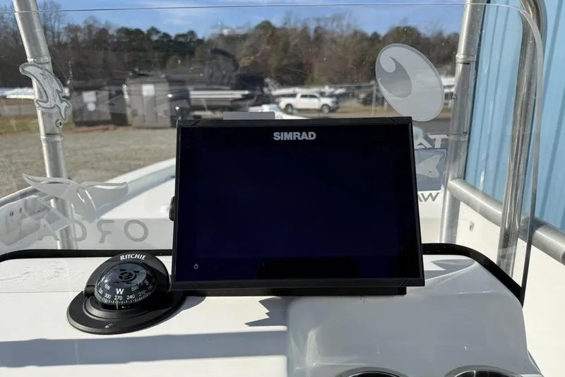 Slide: The Image of Simrad display and compass on 2020 Sea Pro 172 Bay boat dashboard. - 12