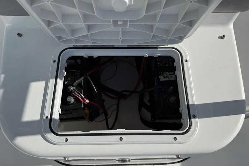 Slide: The Image of Open battery compartment of 2020 Sea Pro 172 Bay boat, showing wiring and connections. - 13
