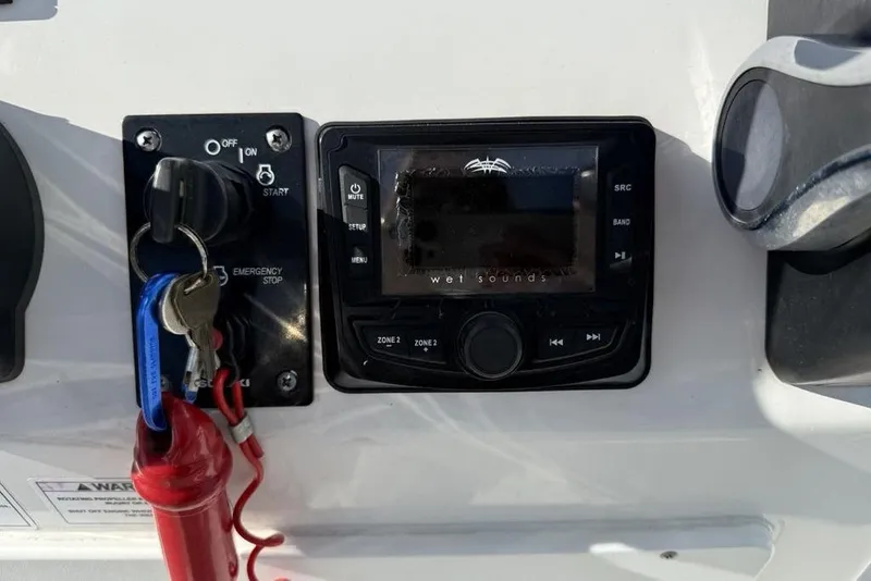 Slide: The Image of 2020 Sea Pro 172 Bay boat dashboard with ignition and Wet Sounds audio system. - 14