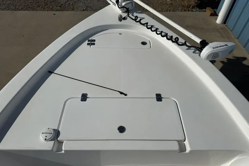 Slide: The Image of 2020 Sea Pro 172 Bay boat deck with storage compartments and trolling motor. - 6