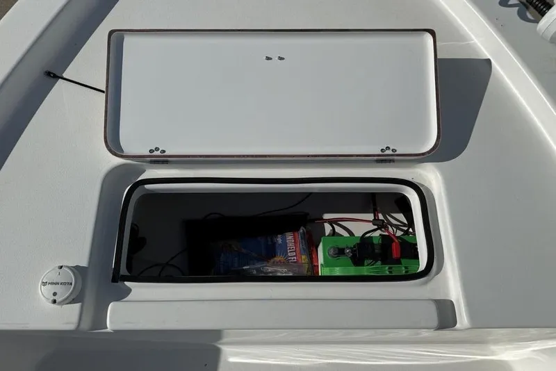 Slide: The Image of 2020 Sea Pro 172 Bay boat storage compartment with battery and wiring. - 9