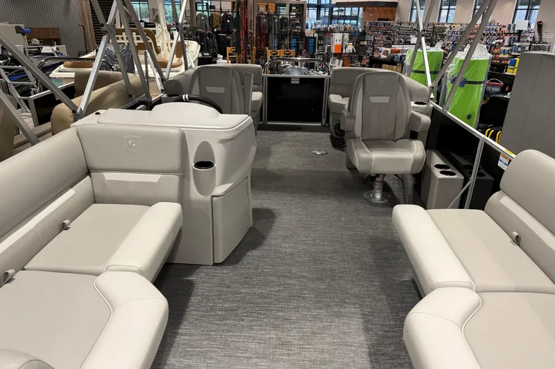 Slide: The Image of 2025 Godfrey Xperience 2086 SBX pontoon boat interior with plush seating and modern design. - 4