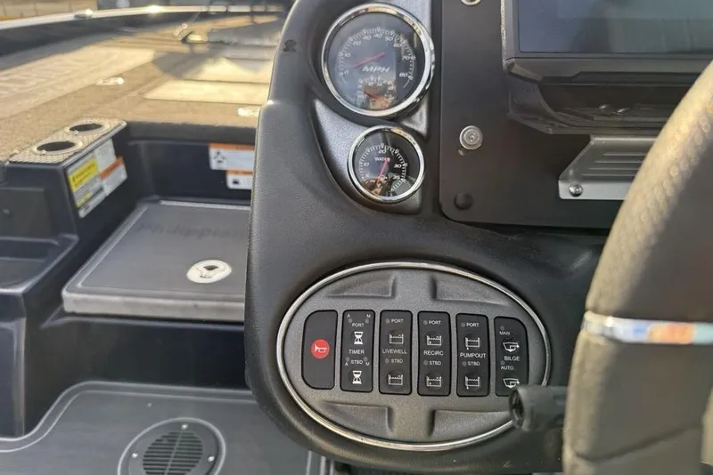 Slide: The Image of Dashboard of a 2021 Triton 21 TrX boat with gauges and control panel. - 15