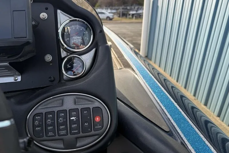 Slide: The Image of Dashboard of a 2021 Triton 21 TrX boat with gauges and control panel. - 18