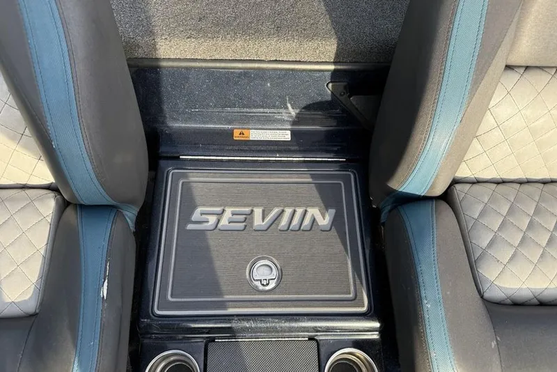 Slide: The Image of Interior of 2021 Triton 21 TrX boat with "SEVIIN" branding between seats. - 19