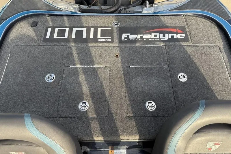 Slide: The Image of 2021 Triton 21 TrX boat deck with Ionic Batteries and FeraDyne Outdoors logos. - 24