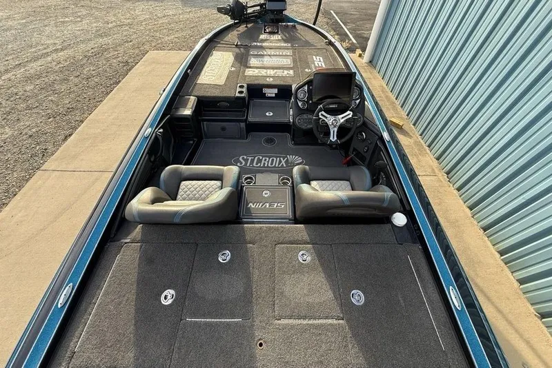 Slide: The Image of 2021 Triton 21 TrX boat interior with dual seats and steering console. - 25