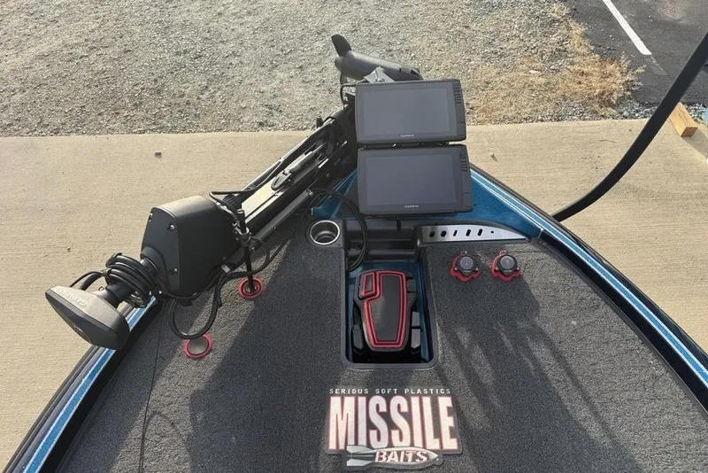 Slide: The Image of 2021 Triton 21 TrX boat deck with dual screens and trolling motor. - 4