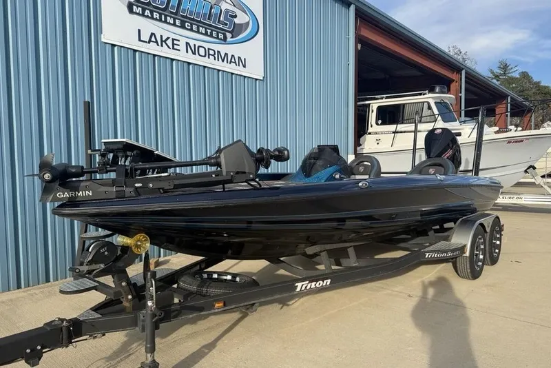 Slide: The Image of 2021 Triton 21 TrX boat on trailer at Lake Norman marine center. - 6