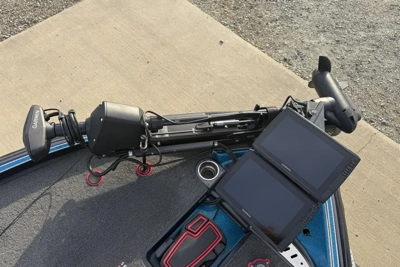 Slide: The Image of 2021 Triton 21 TrX boat with Garmin electronics and trolling motor setup. - 7