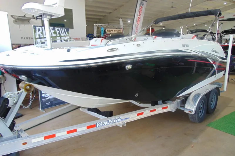 The Image of 2018 Hurricane SunDeck Sport 192 OB boat on trailer in showroom. - 1