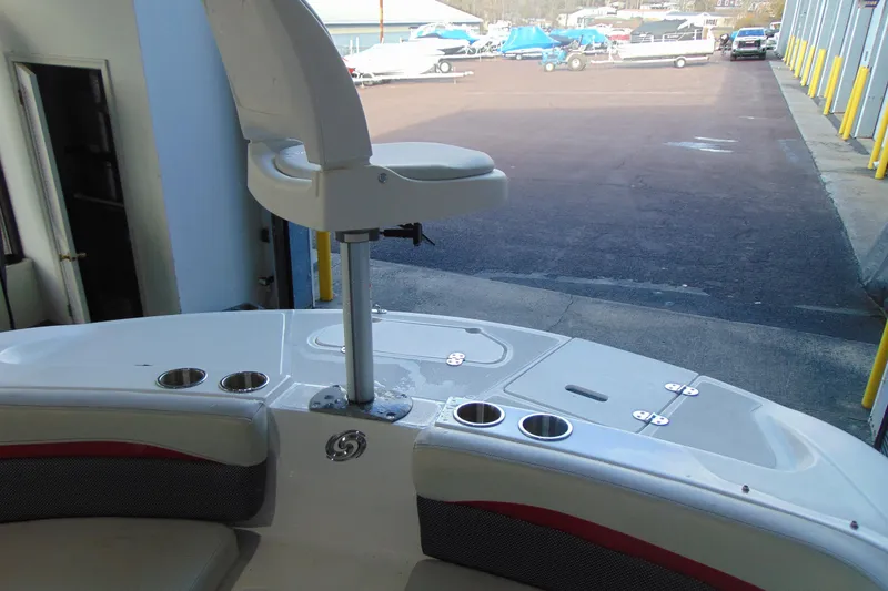 Slide: The Image of 2018 Hurricane SunDeck Sport 192 OB boat interior with seating and cup holders. - 12