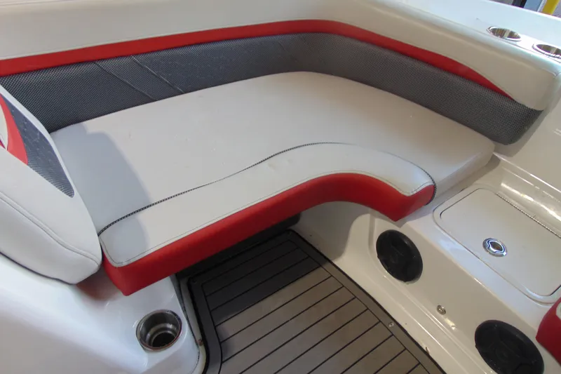 Slide: The Image of 2018 Hurricane SunDeck Sport 192 OB boat interior with red and gray seating. - 13