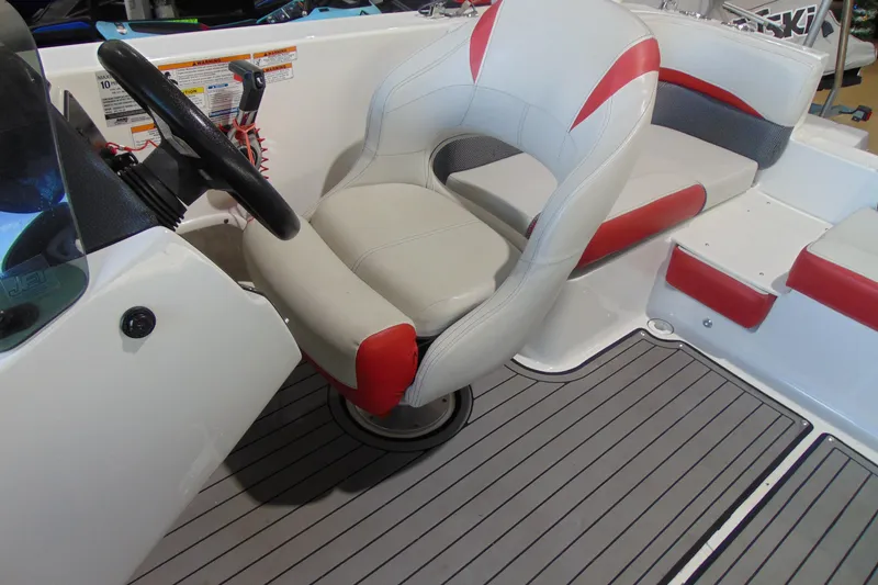 Slide: The Image of 2018 Hurricane SunDeck Sport 192 OB boat interior with steering wheel and seating. - 15