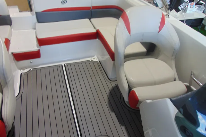 Slide: The Image of 2018 Hurricane SunDeck Sport 192 OB interior with red and gray seating, and textured flooring. - 16