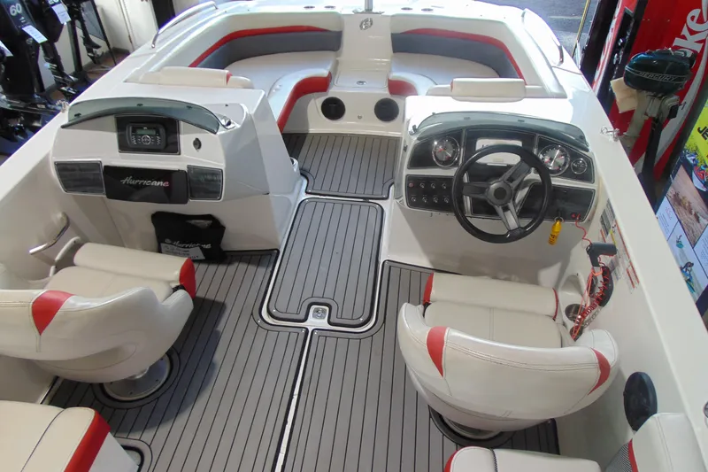 Slide: The Image of 2018 Hurricane SunDeck Sport 192 OB boat interior with steering wheel and seating. - 5