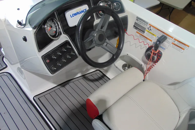 Slide: The Image of 2018 Hurricane SunDeck Sport 192 OB boat dashboard with steering wheel and controls. - 8