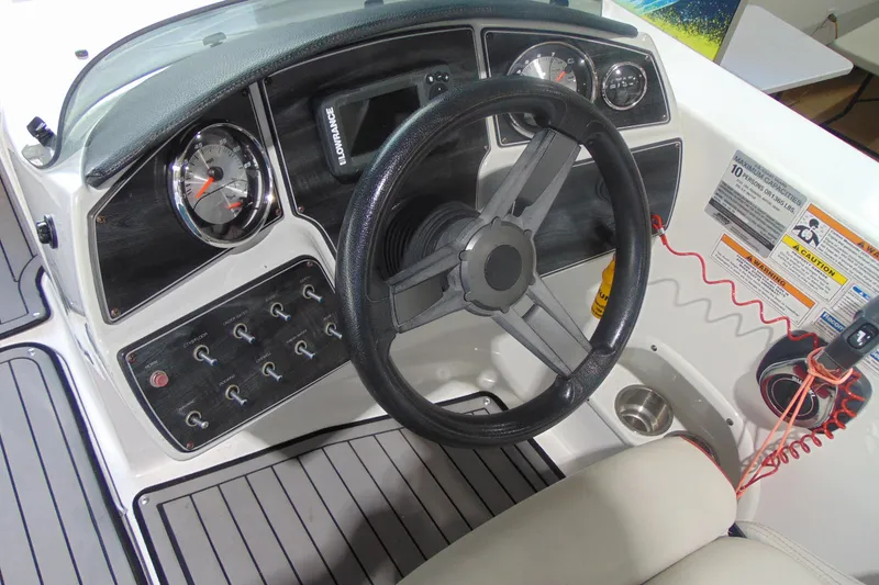 Slide: The Image of 2018 Hurricane SunDeck Sport 192 OB boat dashboard with steering wheel and control panel. - 9