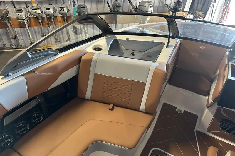 Slide: The Image of 2026 Malibu Wakesetter 23 LSV interior with brown and white seating, modern design. - 10