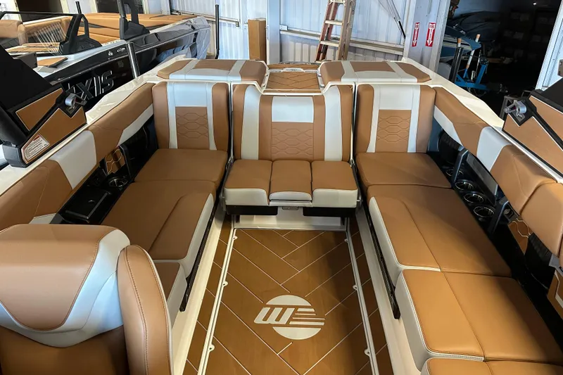 Slide: The Image of 2026 Malibu Wakesetter 23 LSV interior with luxurious tan and white seating. - 14