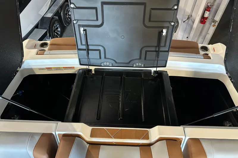 Slide: The Image of 2026 Malibu Wakesetter 23 LSV open storage compartments in a sleek, modern design. - 15