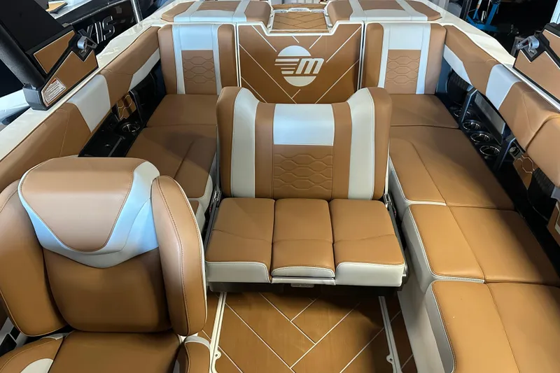 Slide: The Image of Luxurious interior of 2026 Malibu Wakesetter 23 LSV boat with tan and white seating. - 6
