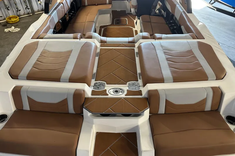 Slide: The Image of 2026 Malibu Wakesetter 23 LSV interior with brown and white seating, modern design. - 8