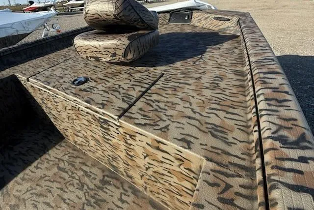 Slide: The Image of 2026 Express XP180 boat with camouflage pattern and seating on deck. - 5