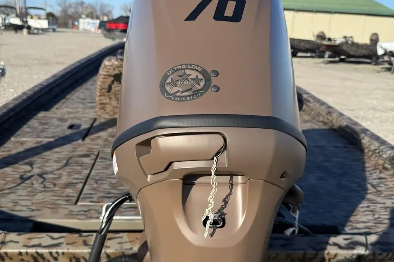 Slide: The Image of 2026 Express XP180 boat engine with ultra-low emission label in outdoor setting. - 8