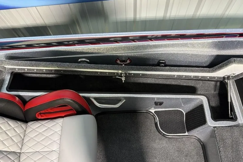 Slide: The Image of Interior view of 2026 Phoenix 721 ZXL boat, featuring sleek seating and storage compartments. - 14