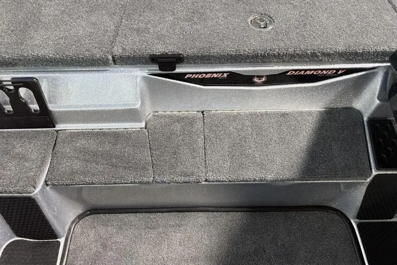 Slide: The Image of 2026 Phoenix 721 ZXL boat deck with carpeted surface and storage compartments. - 16