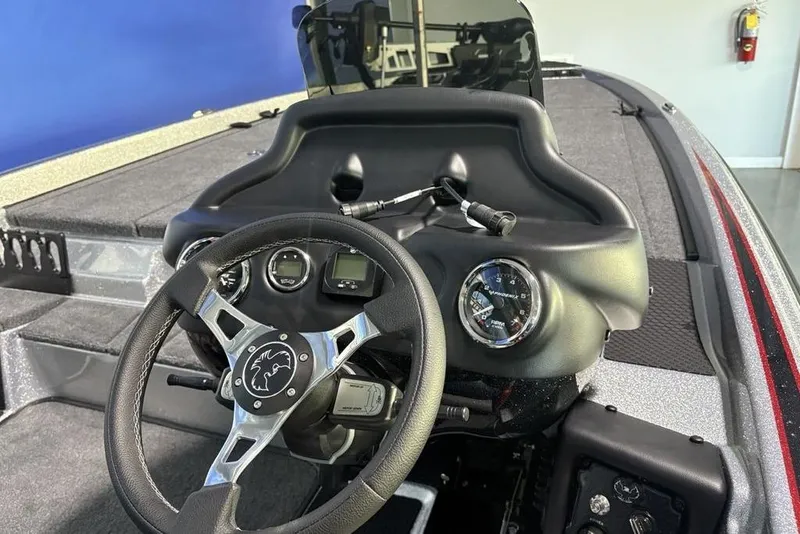 Slide: The Image of 2026 Phoenix 721 ZXL boat dashboard with steering wheel and gauges. - 21