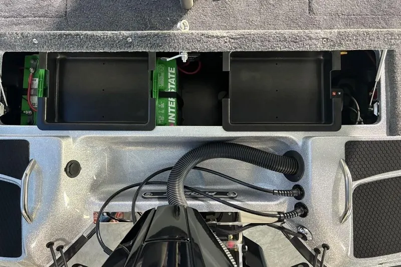 Slide: The Image of 2026 Phoenix 721 ZXL boat battery compartment with Interstate batteries and wiring. - 27